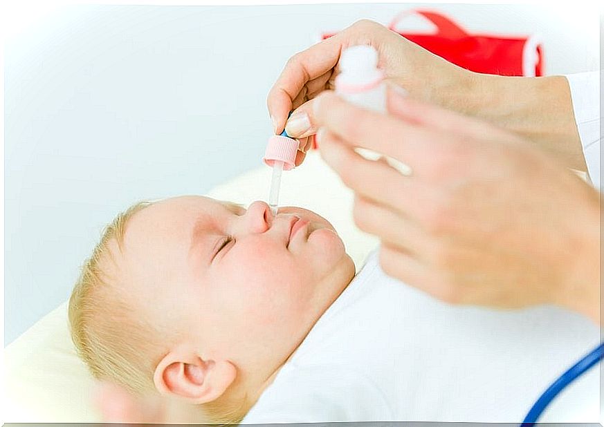 Mother using one of the methods to clear mucus in children