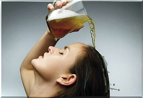 woman throwing beer in her hair