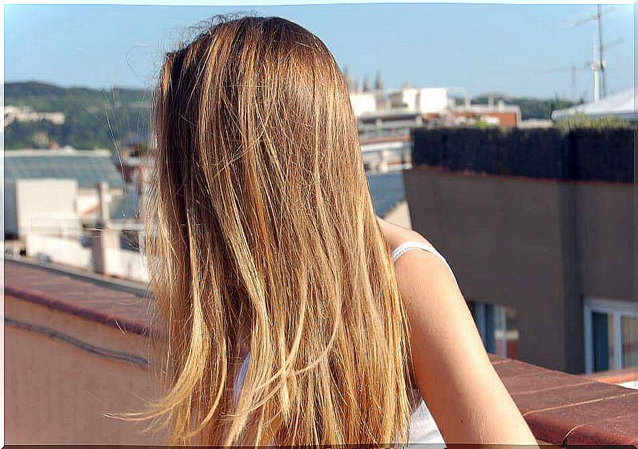 woman exposing her hair to the sun