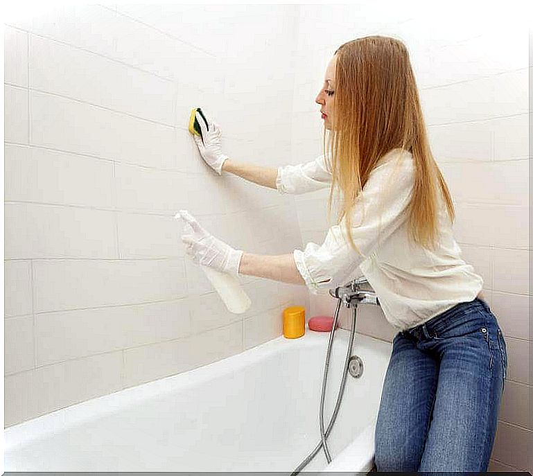 woman cleaning the bathroom