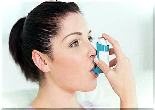 Woman controlling asthma with medication