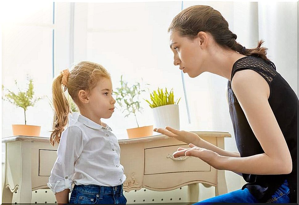 mother explaining something to her daughter